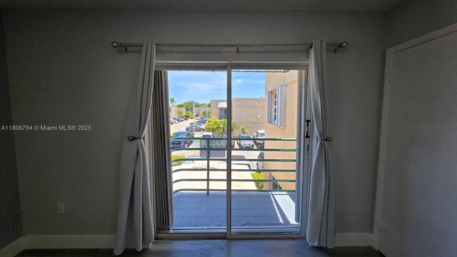 11890 SW 18th Ter Unit 112, Miami, FL 33175 - doorway with baseboards