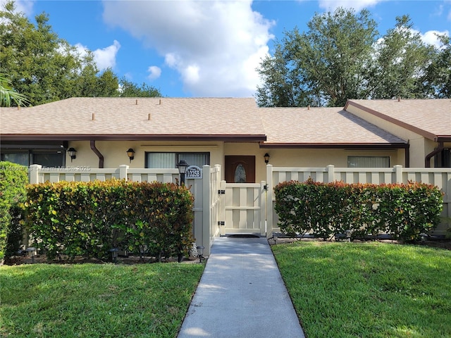 1025 Green Pine Blvd Unit B, West Palm Beach, FL 33409 - view of front of house featuring a shingled roof and stucco siding