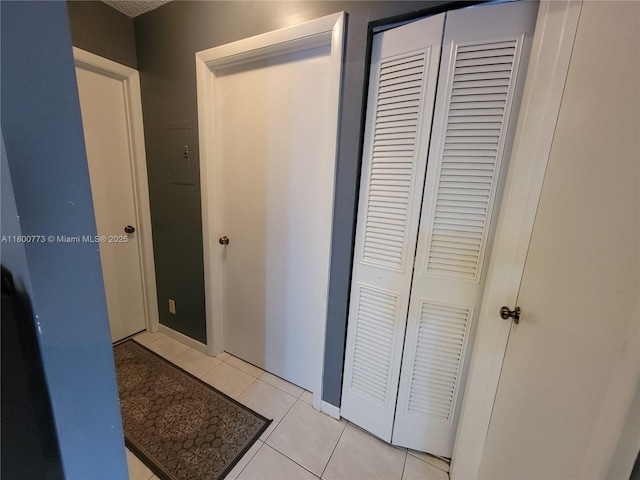 1025 Green Pine Blvd Unit B, West Palm Beach, FL 33409 - hall featuring light tile patterned flooring and baseboards