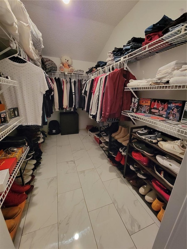 1025 Green Pine Blvd Unit B, West Palm Beach, FL 33409 - spacious closet with marble finish floors and lofted ceiling