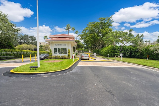 14475 Strathmore Ln Unit 305, Delray Beach, FL 33446 - view of front of house featuring a front yard and a tiled roof