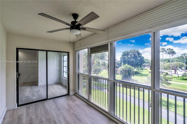 14475 Strathmore Ln Unit 305, Delray Beach, FL 33446 - unfurnished sunroom featuring a ceiling fan