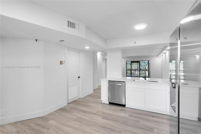 14475 Strathmore Ln Unit 305, Delray Beach, FL 33446 - kitchen with stainless steel dishwasher, fridge, white cabinetry, light countertops, and light wood-type flooring