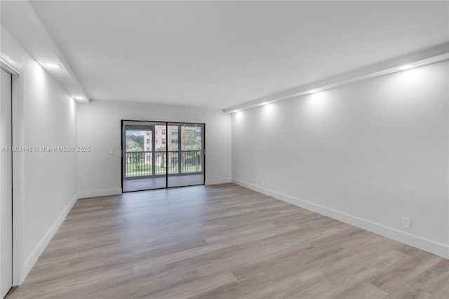 14475 Strathmore Ln Unit 305, Delray Beach, FL 33446 - unfurnished room with light wood-style floors and baseboards