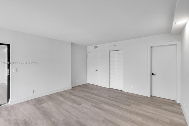 14475 Strathmore Ln Unit 305, Delray Beach, FL 33446 - unfurnished bedroom featuring light wood-style floors and baseboards