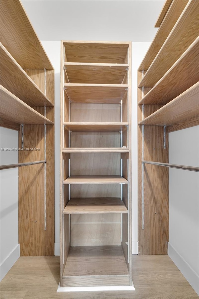 14475 Strathmore Ln Unit 305, Delray Beach, FL 33446 - walk in closet featuring wood finished floors