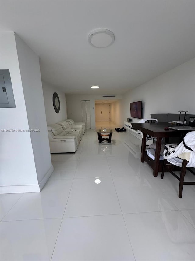 6423 Collins Ave Unit 1001, Miami Beach, FL 33141 - living room featuring electric panel, baseboards, and light tile patterned floors