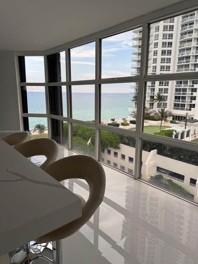 6423 Collins Ave Unit 1001, Miami Beach, FL 33141 - sunroom featuring a water view
