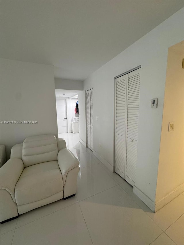 6423 Collins Ave Unit 1001, Miami Beach, FL 33141 - living room with tile patterned flooring and baseboards