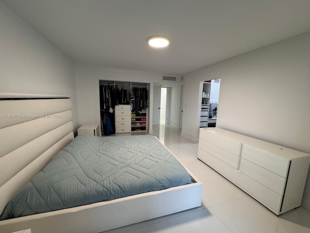 6423 Collins Ave Unit 1001, Miami Beach, FL 33141 - bedroom featuring light tile patterned flooring and a closet