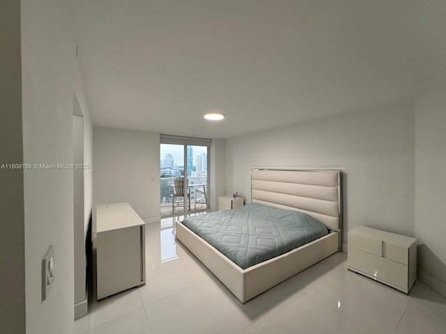 6423 Collins Ave Unit 1001, Miami Beach, FL 33141 - bedroom with light tile patterned floors, recessed lighting, and baseboards