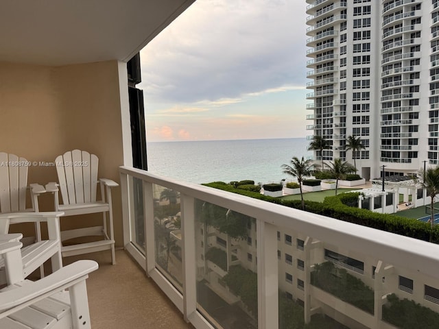 6423 Collins Ave Unit 1001, Miami Beach, FL 33141 - balcony at dusk featuring a water view