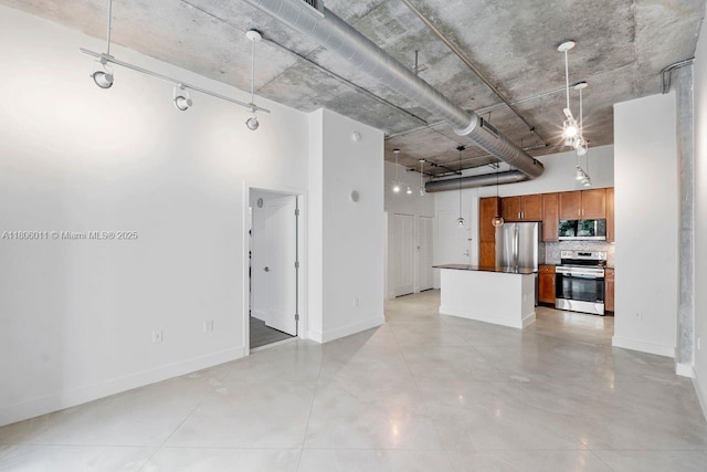 2001 Biscayne Blvd Unit 2308, Miami, FL 33137 - unfurnished living room featuring a high ceiling and baseboards