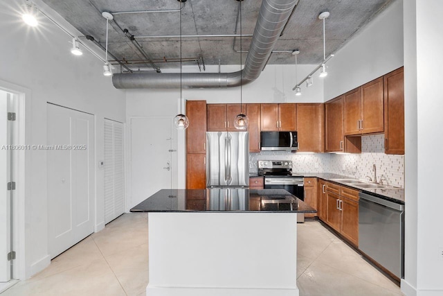 2001 Biscayne Blvd Unit 2308, Miami, FL 33137 - kitchen with stainless steel appliances, a sink, a towering ceiling, light tile patterned flooring, and a kitchen island