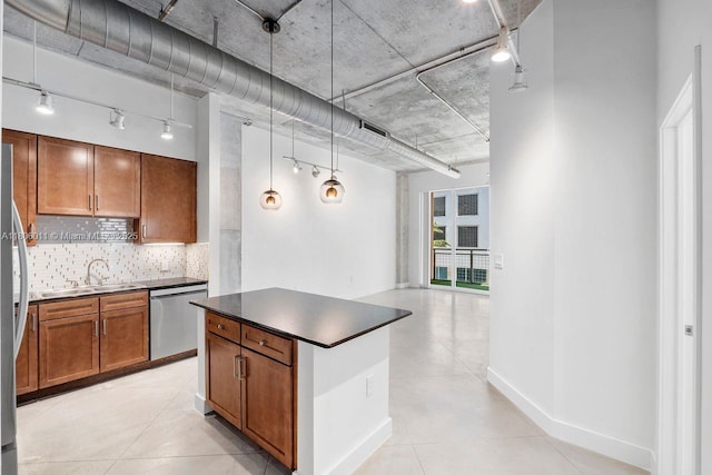 2001 Biscayne Blvd Unit 2308, Miami, FL 33137 - kitchen featuring appliances with stainless steel finishes, track lighting, a sink, tasteful backsplash, and dark countertops