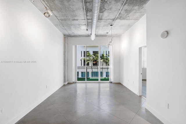 2001 Biscayne Blvd Unit 2308, Miami, FL 33137 - unfurnished room featuring baseboards, a smoke detector, and concrete flooring