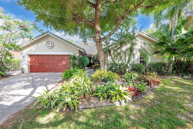 2215 SW 14th Pl, Boca Raton, FL 33486 - mediterranean / spanish-style house with stucco siding, a garage, and decorative driveway