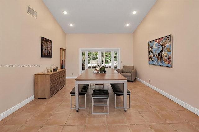 2215 SW 14th Pl, Boca Raton, FL 33486 - dining room with vaulted ceiling, recessed lighting, light tile patterned floors, and french doors