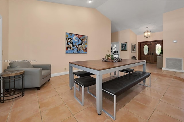 2215 SW 14th Pl, Boca Raton, FL 33486 - dining space featuring a chandelier, light tile patterned floors, and high vaulted ceiling