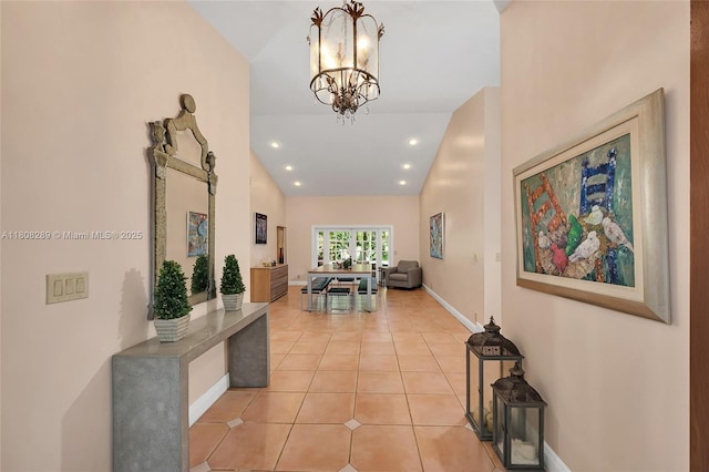 2215 SW 14th Pl, Boca Raton, FL 33486 - corridor with vaulted ceiling, a chandelier, light tile patterned floors, and recessed lighting