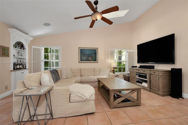 2215 SW 14th Pl, Boca Raton, FL 33486 - living area featuring vaulted ceiling, ceiling fan, light tile patterned floors, and healthy amount of natural light