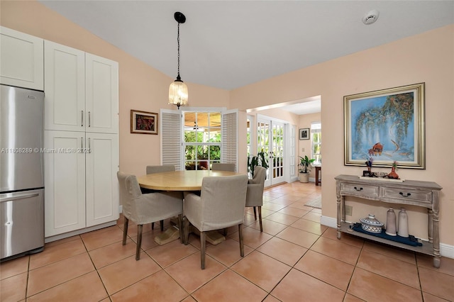 2215 SW 14th Pl, Boca Raton, FL 33486 - dining room featuring healthy amount of natural light, light tile patterned floors, lofted ceiling, and a chandelier