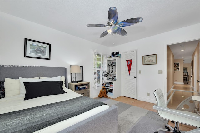 2215 SW 14th Pl, Boca Raton, FL 33486 - bedroom with light tile patterned floors and ceiling fan