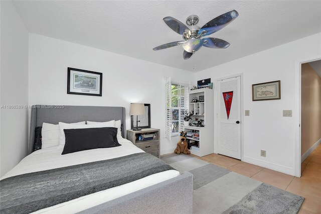 2215 SW 14th Pl, Boca Raton, FL 33486 - bedroom featuring a desk, light tile patterned floors, and ceiling fan