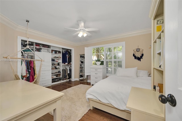 2215 SW 14th Pl, Boca Raton, FL 33486 - bedroom featuring crown molding, dark wood-style flooring, a closet, and a ceiling fan