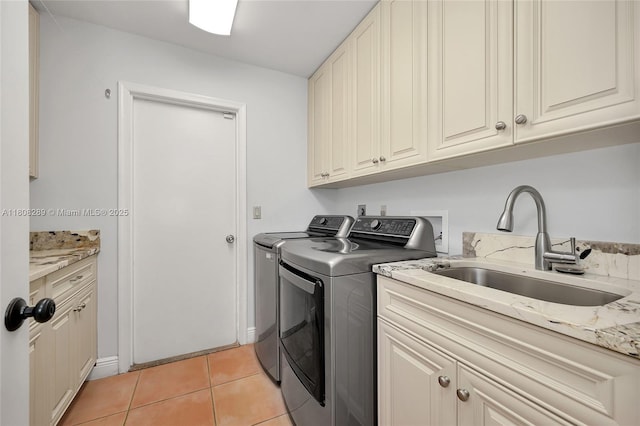2215 SW 14th Pl, Boca Raton, FL 33486 - laundry room with washing machine and dryer, cabinet space, and light tile patterned flooring