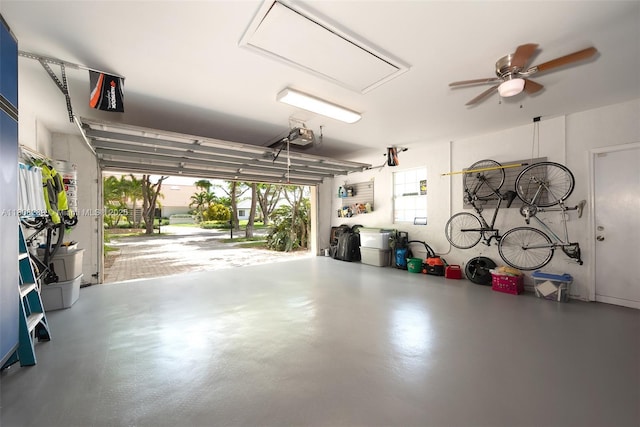 2215 SW 14th Pl, Boca Raton, FL 33486 - garage with a garage door opener and ceiling fan