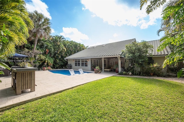 2215 SW 14th Pl, Boca Raton, FL 33486 - outdoor pool featuring a yard and a patio area