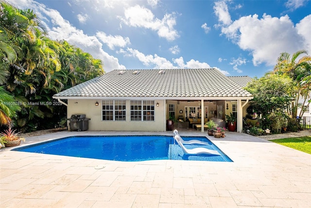 2215 SW 14th Pl, Boca Raton, FL 33486 - outdoor pool featuring a patio area, grilling area, and ceiling fan