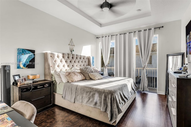 17612 SW 153rd Ave, Miami, FL 33187 - bedroom featuring dark wood finished floors, a tray ceiling, access to exterior, and ceiling fan