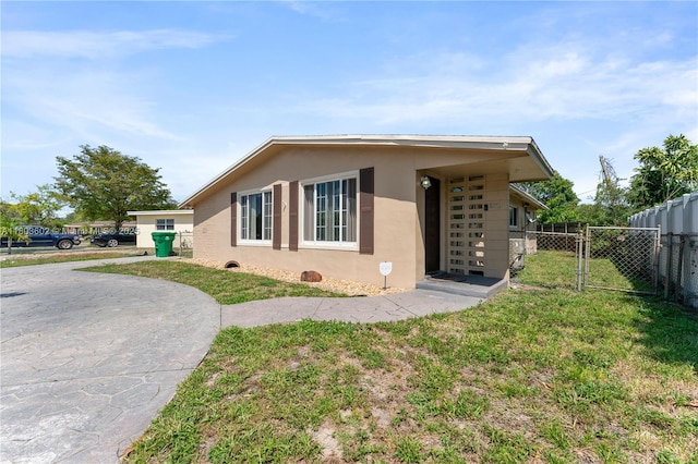 2071 SW 68th Way, Miramar, FL 33023 - view of property exterior featuring stucco siding and a gate