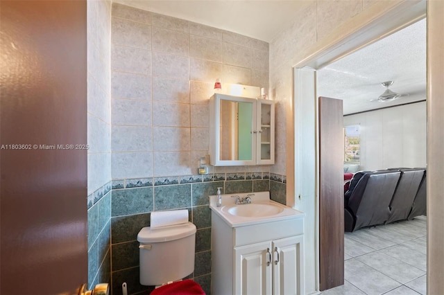 2071 SW 68th Way, Miramar, FL 33023 - bathroom with vanity, tile walls, tile patterned floors, and toilet