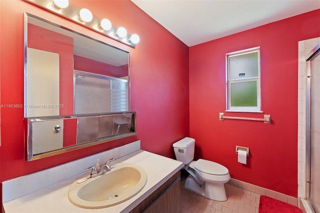 2071 SW 68th Way, Miramar, FL 33023 - bathroom with toilet, tile patterned floors, vanity, and an enclosed shower