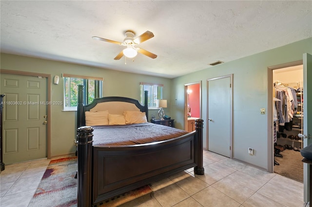2071 SW 68th Way, Miramar, FL 33023 - bedroom with light tile patterned flooring, a walk in closet, ensuite bath, ceiling fan, and a closet