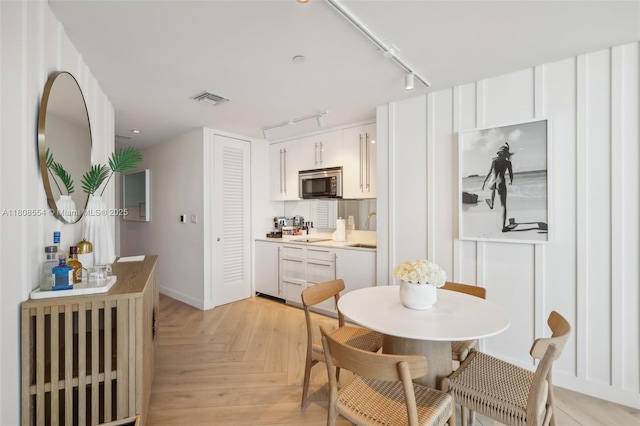 2201 Collins Ave Unit 1511, Miami Beach, FL 33139 - dining area with track lighting and baseboards