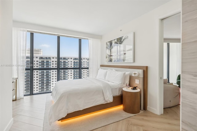 2201 Collins Ave Unit 1511, Miami Beach, FL 33139 - bedroom with a view of city and baseboards