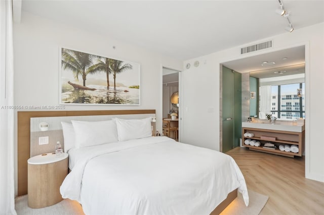 2201 Collins Ave Unit 1511, Miami Beach, FL 33139 - bedroom featuring track lighting