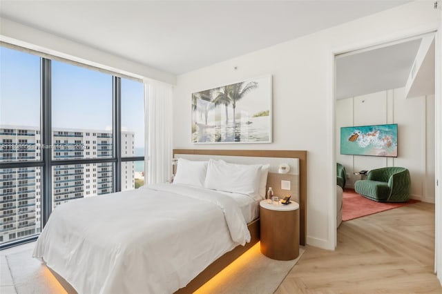 2201 Collins Ave Unit 1511, Miami Beach, FL 33139 - bedroom featuring baseboards and a city view