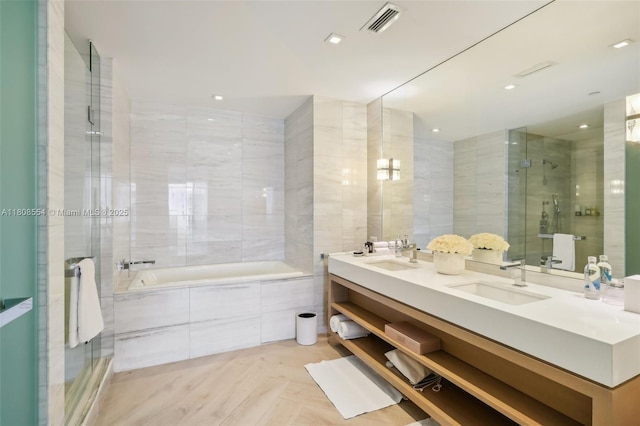 2201 Collins Ave Unit 1511, Miami Beach, FL 33139 - bathroom featuring double vanity, tiled bath, and a shower with shower door