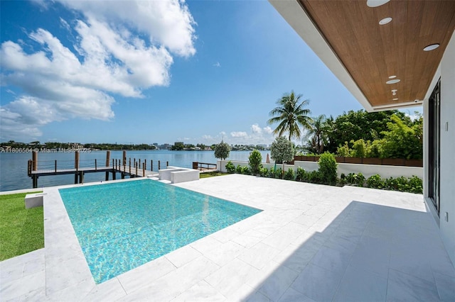 1351 Stillwater Dr, Miami Beach, FL 33141 - view of pool featuring a water view, a patio, a dock, and a pool