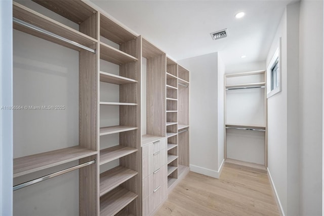 1351 Stillwater Dr, Miami Beach, FL 33141 - spacious closet featuring light wood-style flooring