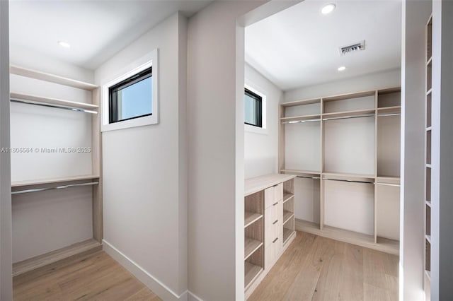 1351 Stillwater Dr, Miami Beach, FL 33141 - walk in closet with wood finished floors