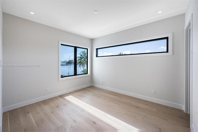 1351 Stillwater Dr, Miami Beach, FL 33141 - unfurnished room featuring light wood finished floors and recessed lighting