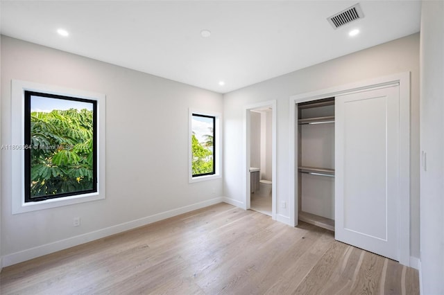 1351 Stillwater Dr, Miami Beach, FL 33141 - unfurnished bedroom featuring light wood-type flooring, baseboards, a closet, and recessed lighting