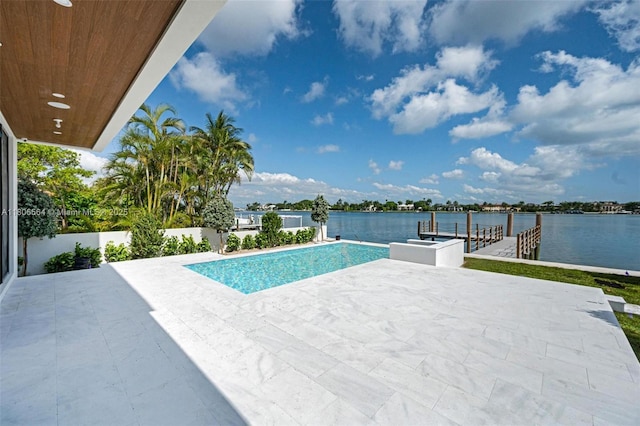 1351 Stillwater Dr, Miami Beach, FL 33141 - view of pool featuring a water view, a patio, and an infinity pool