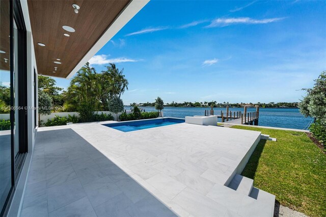 1351 Stillwater Dr, Miami Beach, FL 33141 - outdoor pool with a patio, a water view, and a lawn